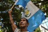 04112019-31/07/2019 31 July 2019, Guatemala, Guatemala City: A Guatemalan holds a flag during a protest against Safe Third Country Agreement between Guatemalan president Jimmy Morales and the Trump administration, in front of the Westin Camino Real hotel. Photo: Miguel Juarez Lugo/ZUMA Wire/dpa POLITICA INTERNACIONAL Miguel Juarez Lugo/ZUMA Wire/dpa