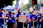 26 June 2020, US, Riverside: Riverside Community Hospital registered nurses, all members of the labor Union SEIU Local 121RN, picket outside the hospital's campus in Riverside, as they launch a 10-day strike over the patient and nurse safety issues. Photo: Watchara Phomicinda/Orange County Register via ZUMA/dpa