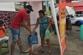 Acapulco,Gro/09Agosto2020/Una mujer pasa por el túnel sanitizador , el Mercado Central del puerto de Acapulco. Foto: Jesús Trigo