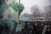 13 December 2020, Poland, Warsaw: A protester holds up a smoke bomb during an anti-government march against the ruling of Poland's top court that would impose a near total ban on abortion. Photo: Aleksander Kalka/ZUMA Wire/dpa