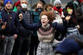 12 November 2021, United Kingdom, Glasgow: A climate activist dances during a protest on the final day of the United Nations Climate Change Conference (COP26). Photo: Andrew Milligan/PA Wire/dpa