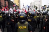 07 December 2021, Peru, Lima: Anti-riot police officers try to contain the crowd during a protest against Peruvian President Castillo and his government. Photo: Carlos Garcia Granthon/ZUMA Press Wire/dpa