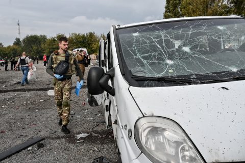 30 September 2022, Ukraine, Zaporizhzhia: Investigators examine the scene of a deadly Russian missile strike on a humanitarian convoy. At least 25 people have been killed and about 50 wounded after Russian troops fired three S-300 missiles at a humanitarian convoy near the Zaporizhzhia-Orikhiv highway. Photo: -/Ukrinform/dpa