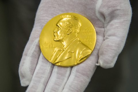 FILED - 29 February 2016, Bavaria, Munich: Wilhelm Fuessl, director of the archive of the Deutsches Museum, holds a Nobel Prize medal. Photo: picture alliance / dpa