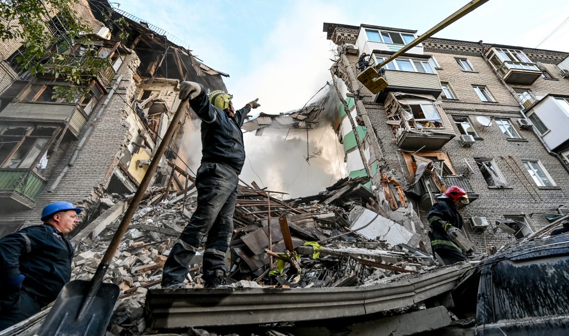 06 October 2022, Ukraine, Zaporizhzhia: Rescuers work at the site that was targeted with multiple missile strikes by Russian troops. Photo: -/Ukrinform/dpa