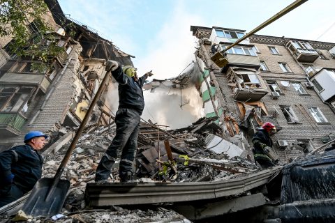 06 October 2022, Ukraine, Zaporizhzhia: Rescuers work at the site that was targeted with multiple missile strikes by Russian troops. Photo: -/Ukrinform/dpa