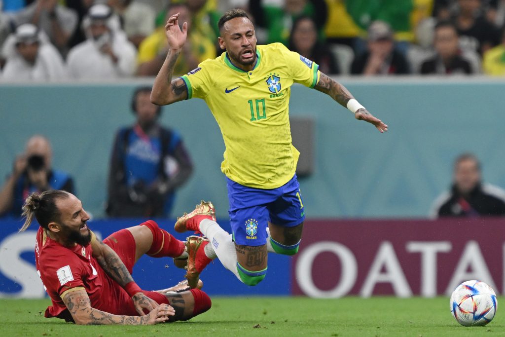 24 November 2022, Qatar, Lusail: Brazil's Neymar (R) and Serbia's Nemanja Gudelj battles for the ball during the FIFA World Cup Qatar 2022 Group G soccer match between Brazil and Serbia at the Lusail Stadium. Photo: Robert Michael/dpa