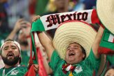 22 November 2022, Qatar, Doha: Fans of Mexico cheer in the stands ahead of the FIFA World Cup Qatar 2022 Group C soccer match between Mexico and Poland at Stadium 974. Photo: Christian Charisius/dpa