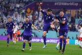 30 November 2022, Qatar, Doha: Argentina's Julian Alvarez (C) celebrates scoring his side's second goal with teammates Enzo Fernandez (R) and Lionell Messi during the FIFA World Cup Qatar 2022 Group C soccer match between Poland and Argentina at Stadium 974. Photo: Tom Weller/dpa