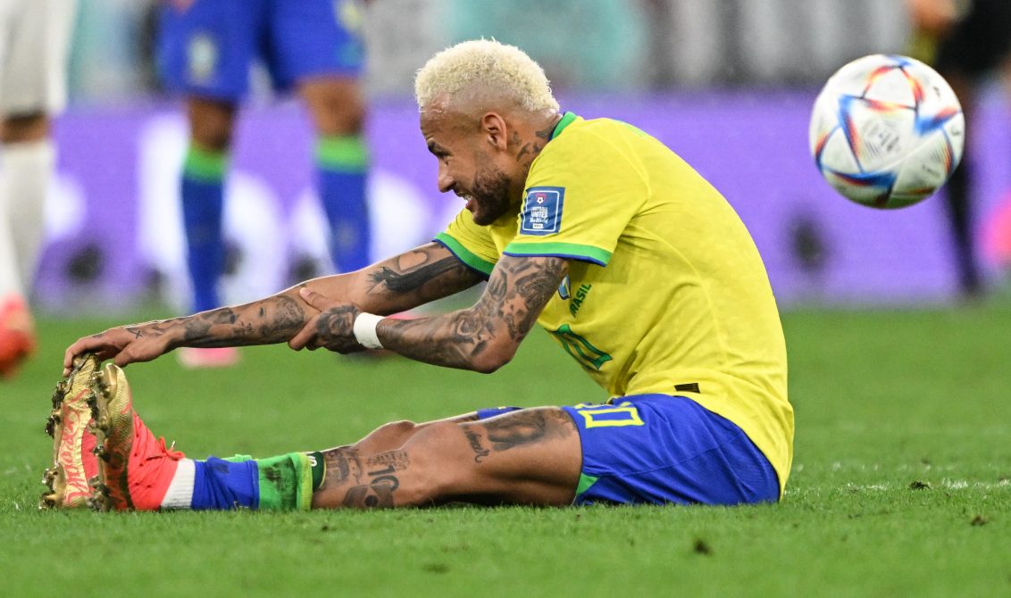 09 December 2022, Qatar, Al-Rayyan: Brazil's Neymar sits on the pitch during the extra time of the FIFA World Cup Qatar 2022 Quarter-Final soccer match between Croatia and Brazil at the Education City Stadium in Al Rayyan. Photo: Robert Michael/dpa