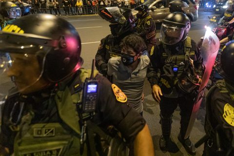 15 December 2022, Peru, Lima: Police officers detain a young man during a demonstration. People have died in various parts of Peru during increasingly violent protests against the ouster of President Castillo, according to government sources. Thousands of people demanded the resignation of Castillo's successor Boluarte as well as the dissolution of parliament, early new elections and the release of the imprisoned ex-president. Photo: Lucas Aguayo Araos/dpa